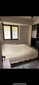 מיטה או מיטות בחדר ב-Apartment VR home hilly side