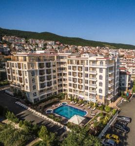 an aerial view of a large apartment building with a pool at SEA-VIEW APARTMENT in VILLA SARDINIA SVETI VLAS in Sveti Vlas