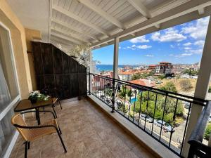 a balcony with a table and a view of the ocean at SEA-VIEW APARTMENT in VILLA SARDINIA SVETI VLAS in Sveti Vlas