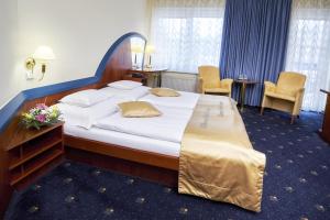 Łóżko lub łóżka w pokoju w obiekcie Hotel Eroplán