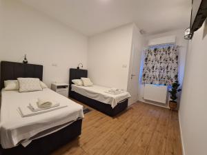 Posteľ alebo postele v izbe v ubytovaní Hotel Garny Pleso