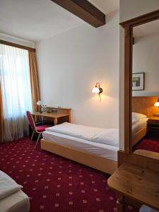 Postel nebo postele na pokoji v ubytování Gasthof Klement