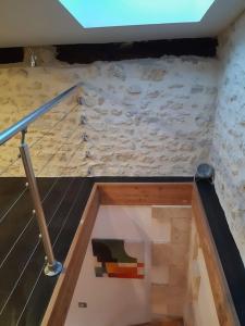 an overhead view of a room with a wall at Le Petit Nid in Saint-Loubès