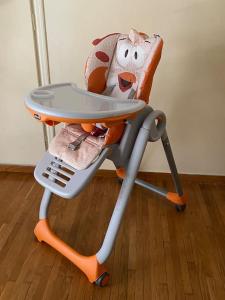 a high chair with a table and a stuffed animal at The House of Electra in Athens