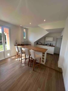 a kitchen with a table and chairs in a room at Completely renovated villa in Cap d'Ail