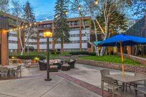 a courtyard with tables and chairs and a building at Delta Hotels by Marriott Racine in Racine