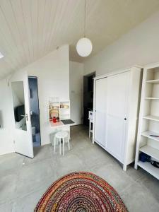 a living room with a table and a rug at appartme. XS in Bad Herrenalb