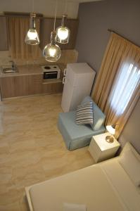 A kitchen or kitchenette at Ammos Apartments