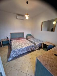 Postelja oz. postelje v sobi nastanitve Casale Bianco al casello dell' autostrada Guidonia