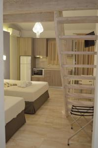 A bed or beds in a room at Ammos Apartments