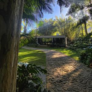 a house in the middle of a garden at Exclusive Oásis by Lotta De Macedo Soares in Petrópolis