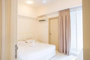 a white bedroom with a bed and a window at Cosy 2Bed2Bathroom at Casa Suites in Petaling Jaya +15 photos