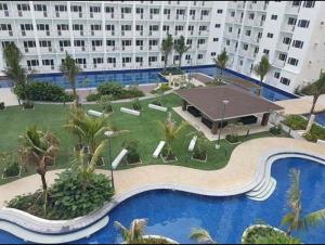 arial view of a large building with a swimming pool at Mi Casa in Manila +7 photos