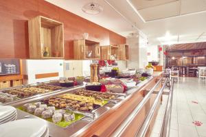a buffet line with many different types of food at Boutique Central in Sibiu
