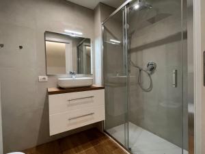a bathroom with a sink and a shower at CamiLa's house in Milan