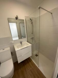 a bathroom with a toilet and a sink and a shower at Antonio Apartment in Los Cristianos +8 photos