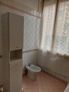 a small bathroom with a toilet and a sink at Casa delle fiabe in Sestri Levante +39 photos