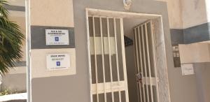 an open door to a building with signs on it at Eolie House in Tropea