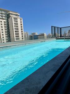 a large swimming pool on top of a building at Eleven by Warren Collection in Sliema