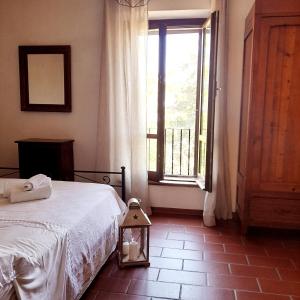 A bed or beds in a room at Il vecchio frantoio
