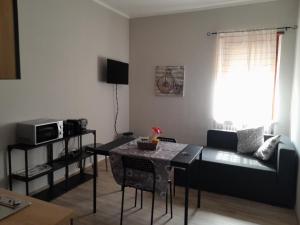 TV a/nebo společenská místnost v ubytování Casa Cris - Torre Pellice-TO- + 1 fotografie