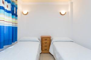 Posteľ alebo postele v izbe v ubytovaní Apartamento Cómodo y Céntrico, Los Cristianos