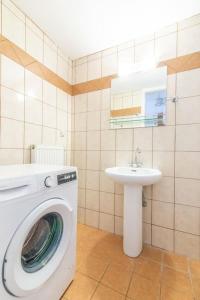 a bathroom with a washing machine and a sink at Urban Apt Next University 5 in Heraklio Town