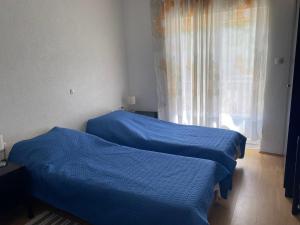 Postel nebo postele na pokoji v ubytování Happy Day