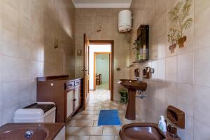 a bathroom with a sink and a toilet at Villetta Dany by BarbarHouse in Torre Lapillo