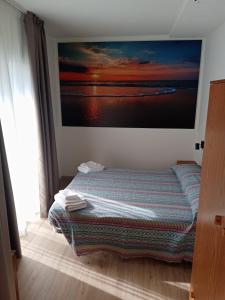 A bed or beds in a room at Oasi Mamma dell'Amore & Villaggio della Gioia