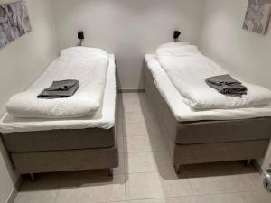 Un pat sau paturi într-o cameră la Plomben C