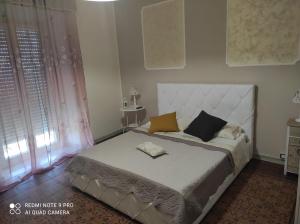 Giường trong phòng chung tại B&b al conte ruggero
