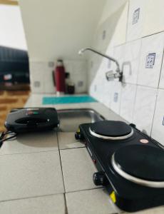 a black toilet sitting on a counter in a kitchen at Misiones Depa33 in Posadas