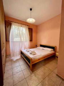 Ένα ή περισσότερα κρεβάτια σε δωμάτιο στο Filoxenia Residence