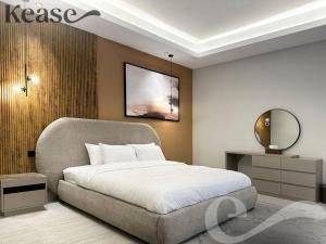 a bedroom with a large bed and a mirror at Kease King Salman T-6 Royal Touch GZ61 in Riyadh