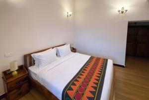 Postel nebo postele na pokoji v ubytování Ibex Resorts, Coonoor Leewood