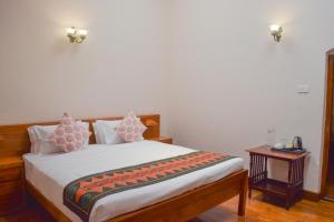 Postel nebo postele na pokoji v ubytování Ibex Resorts, Coonoor Leewood