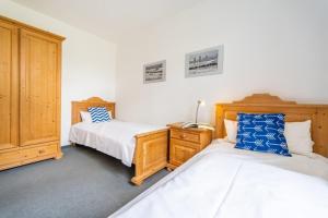 Postel nebo postele na pokoji v ubytování Haus Arkonablick - Fewo 1 04 Dünenblick