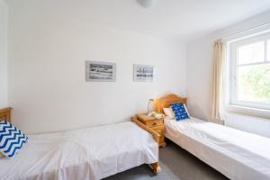 Postel nebo postele na pokoji v ubytování Haus Arkonablick - Fewo 1 04 Dünenblick