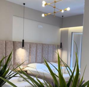 Postel nebo postele na pokoji v ubytování Karos Hotel Llaman