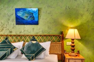 Postel nebo postele na pokoji v ubytování Fihalhohi Maldives
