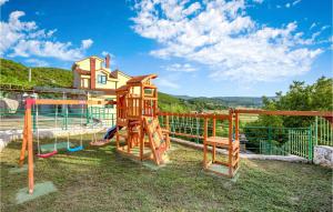 a playground with a slide and a swing at Lovely Home In Mirlovic Polje With Sauna in Mirlović-Polje