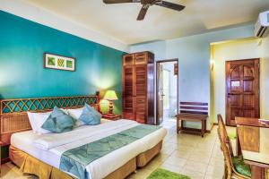 Postel nebo postele na pokoji v ubytování Fihalhohi Maldives