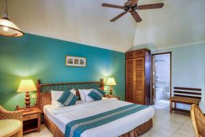 Postel nebo postele na pokoji v ubytování Fihalhohi Maldives