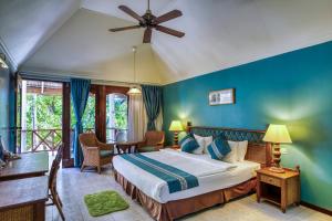 Postel nebo postele na pokoji v ubytování Fihalhohi Maldives