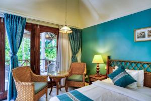 Postel nebo postele na pokoji v ubytování Fihalhohi Maldives