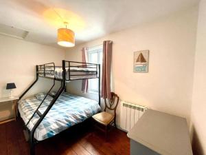 a bedroom with a bunk bed and a desk at Little Tern - Rye Harbour - Games room & Office in Rye Harbour