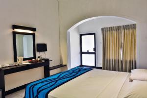 En eller flere senge i et værelse på Amagi Beach – Secluded Slice of Paradise