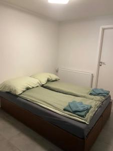 a unmade bed in a room with at Gemütliche Ferienwohnung EVIELINE in Todtnau in Todtnau