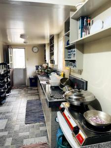 A kitchen or kitchenette at Melia's House Baguio - Nature Home for Rent